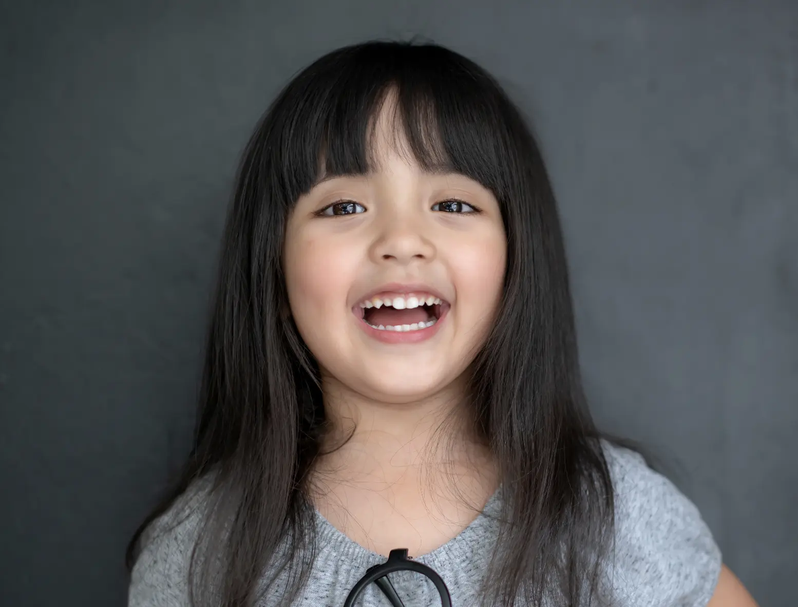 Smiling child portrait for early expansion and arch development section