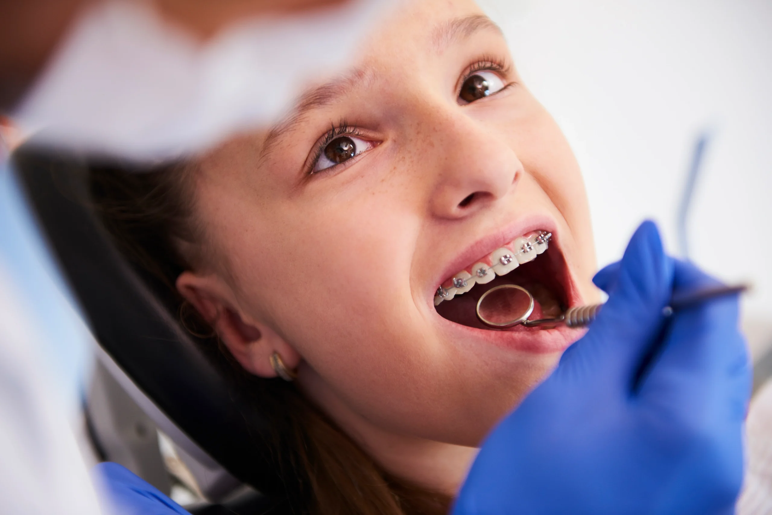 Patient with braces during dental visit