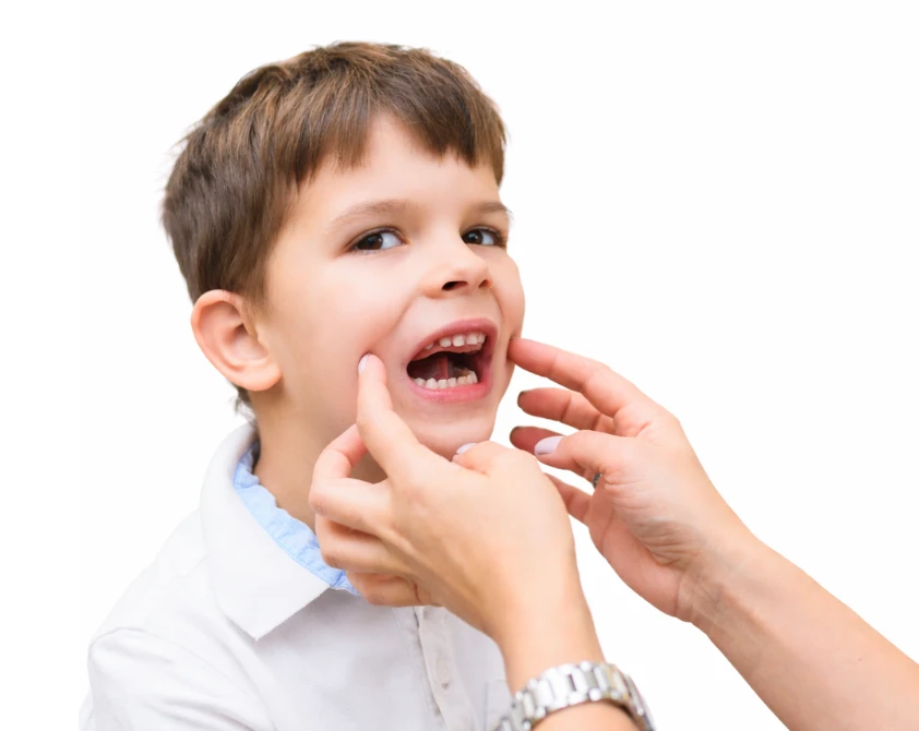 Child receiving oral assessment or myofunctional support guidance